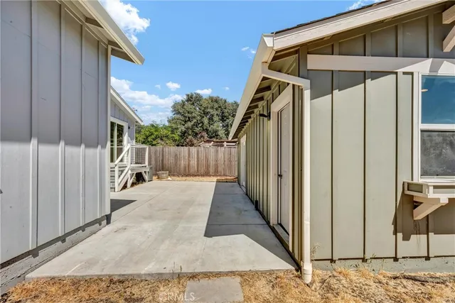a view of a house with wooden floor and wooden fence