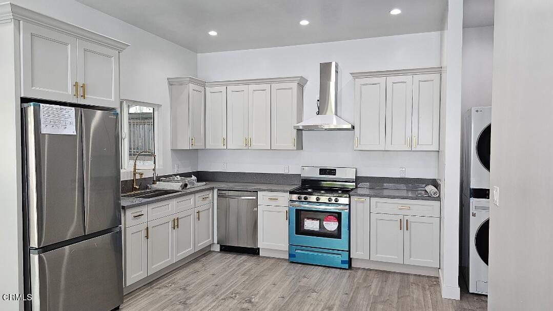 214 Valle Vista Avenue, Unit 2 Monrovia, CA 91016 - Photo 2 of 11 a kitchen with stainless steel appliances granite countertop a stove a refrigerator and a sink