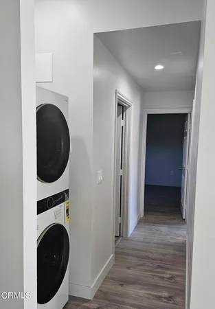 a view of a hallway with washer and dryer