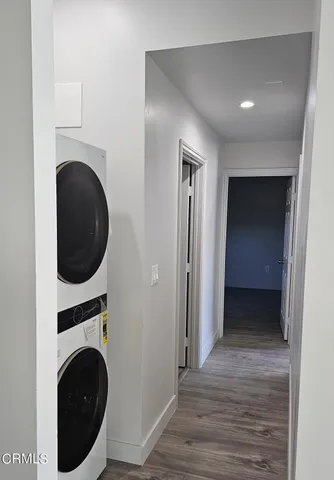 a view of a hallway with washer and dryer