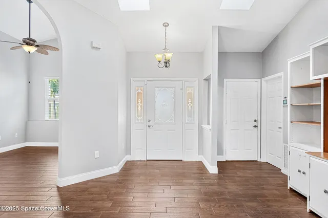 a view of a house with a yard patio and a garden
