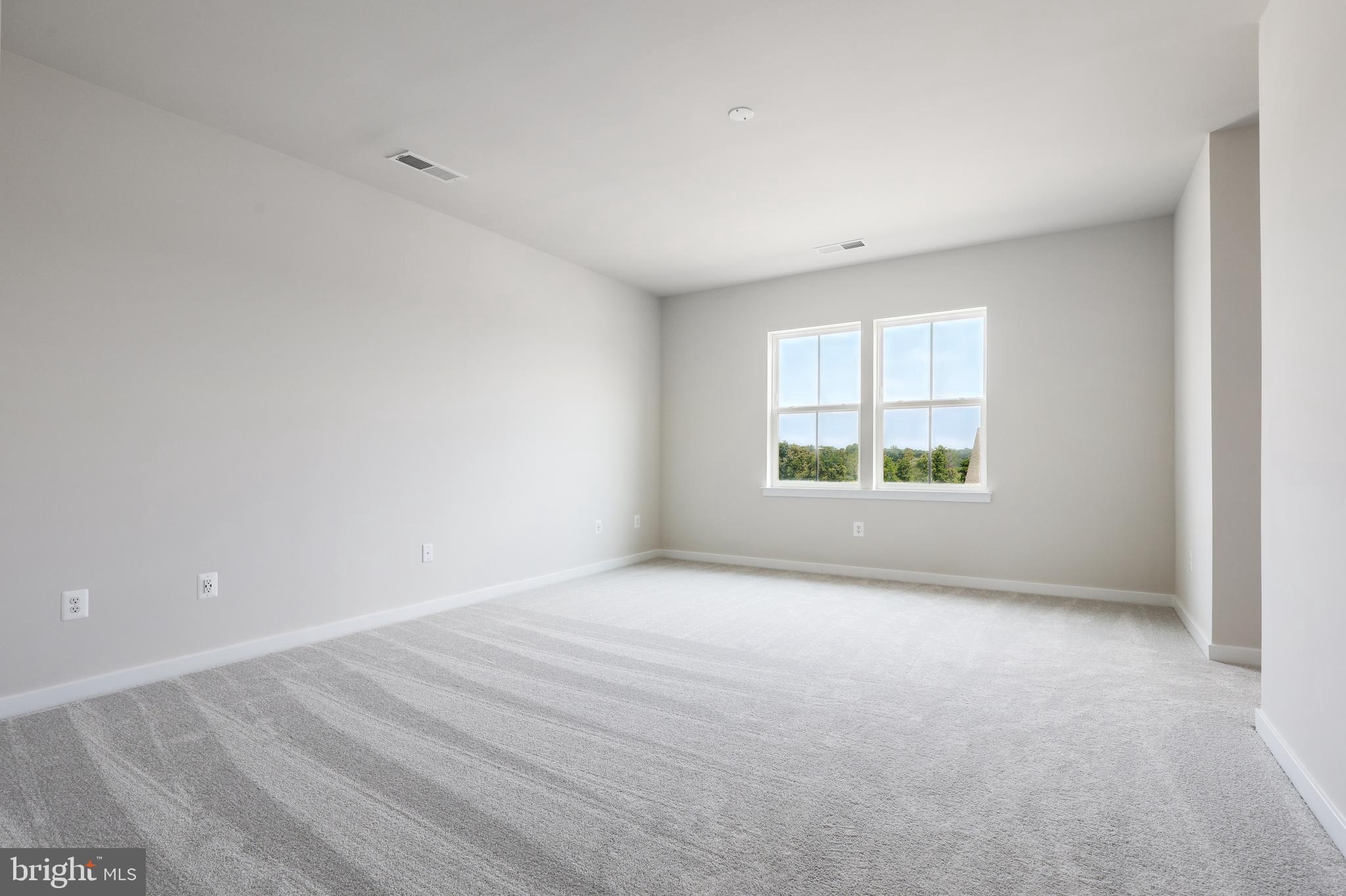 430 Silver Birch Drive, Unit ASHTON 241 Ranson, WV 25438 - Photo 12 of 23 an empty room with windows