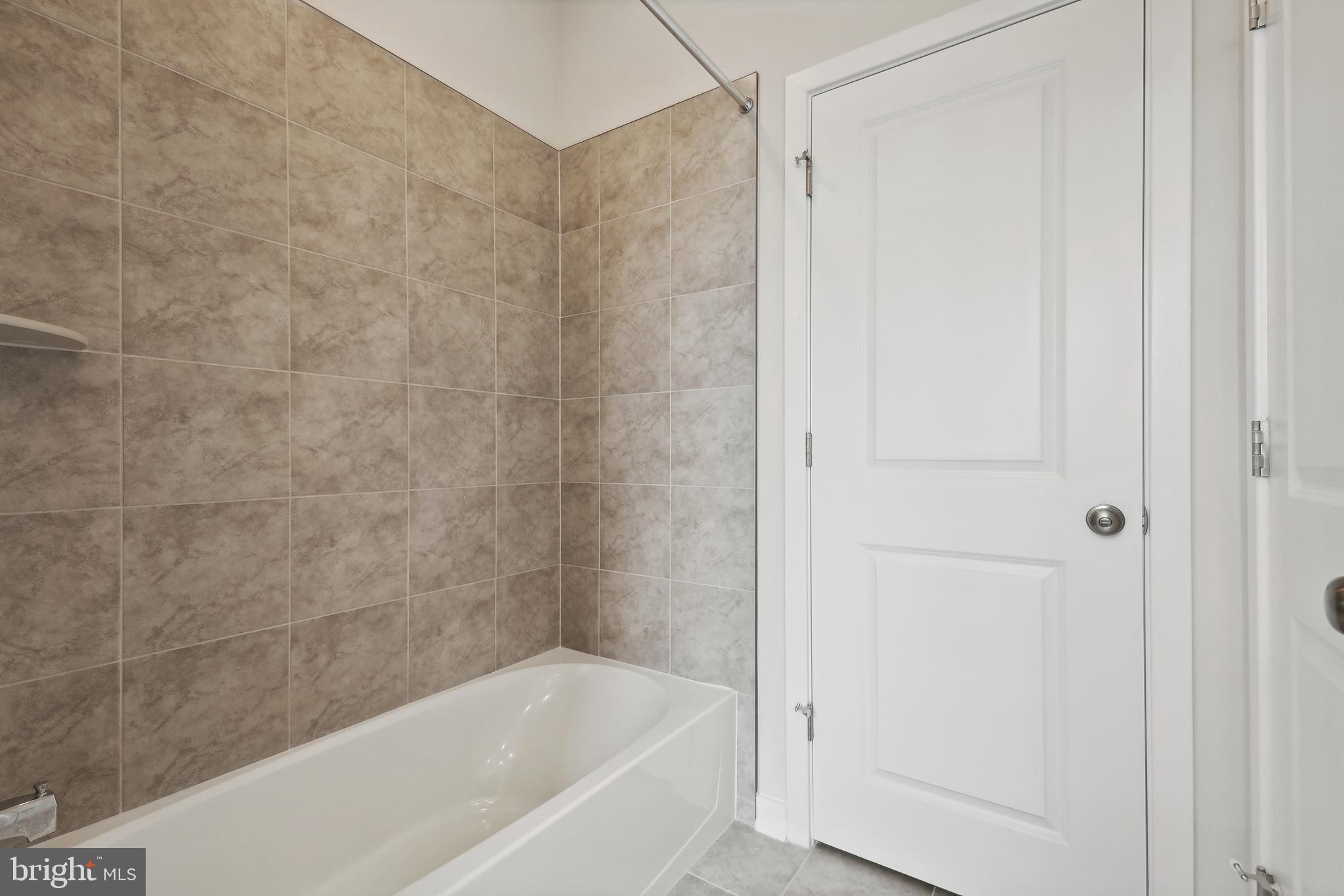 430 Silver Birch Drive, Unit ASHTON 241 Ranson, WV 25438 - Photo 18 of 23 a bathroom with a bathtub