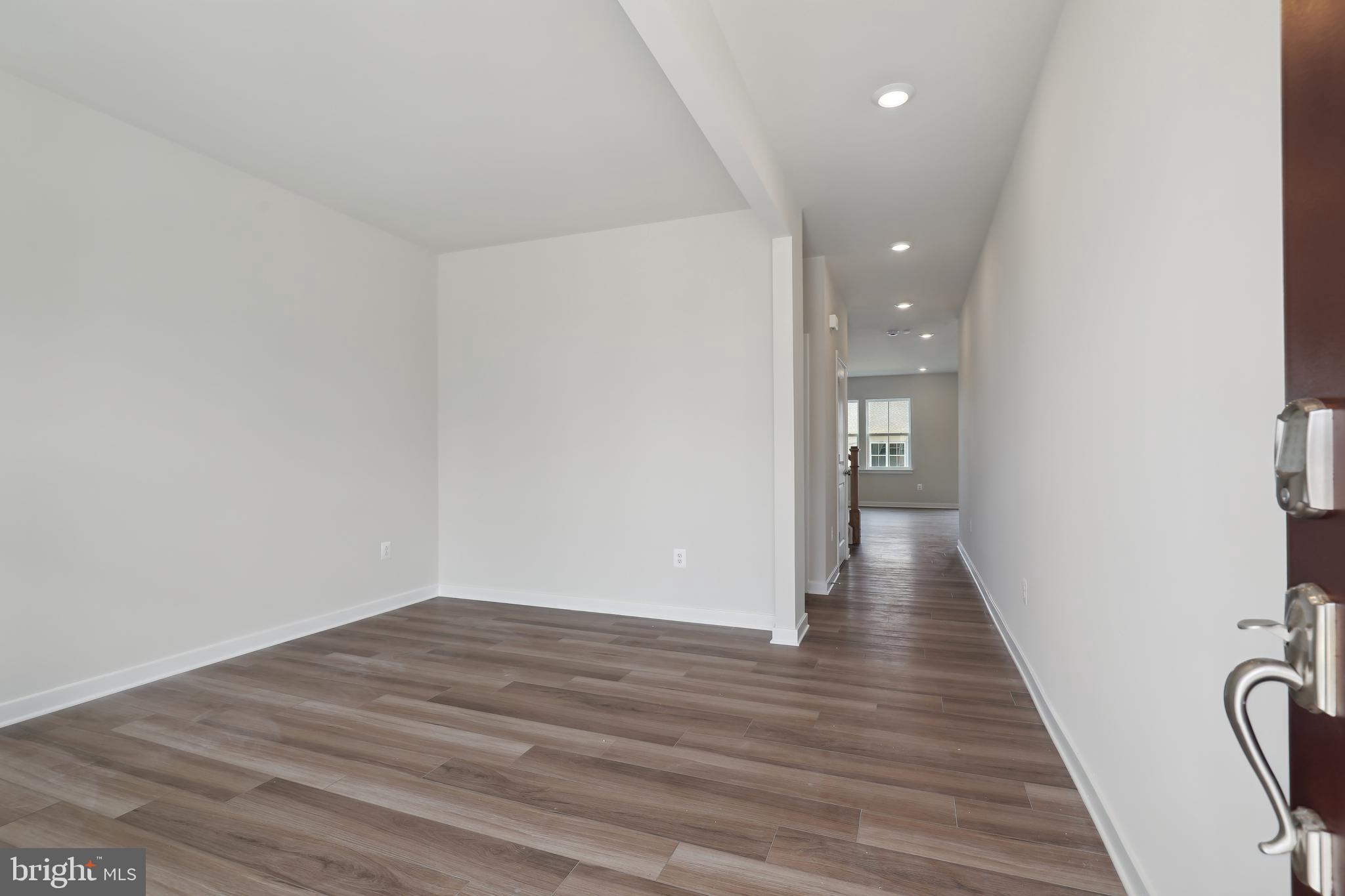 430 Silver Birch Drive, Unit ASHTON 241 Ranson, WV 25438 - Photo 2 of 23 a view of a hallway with wooden floor
