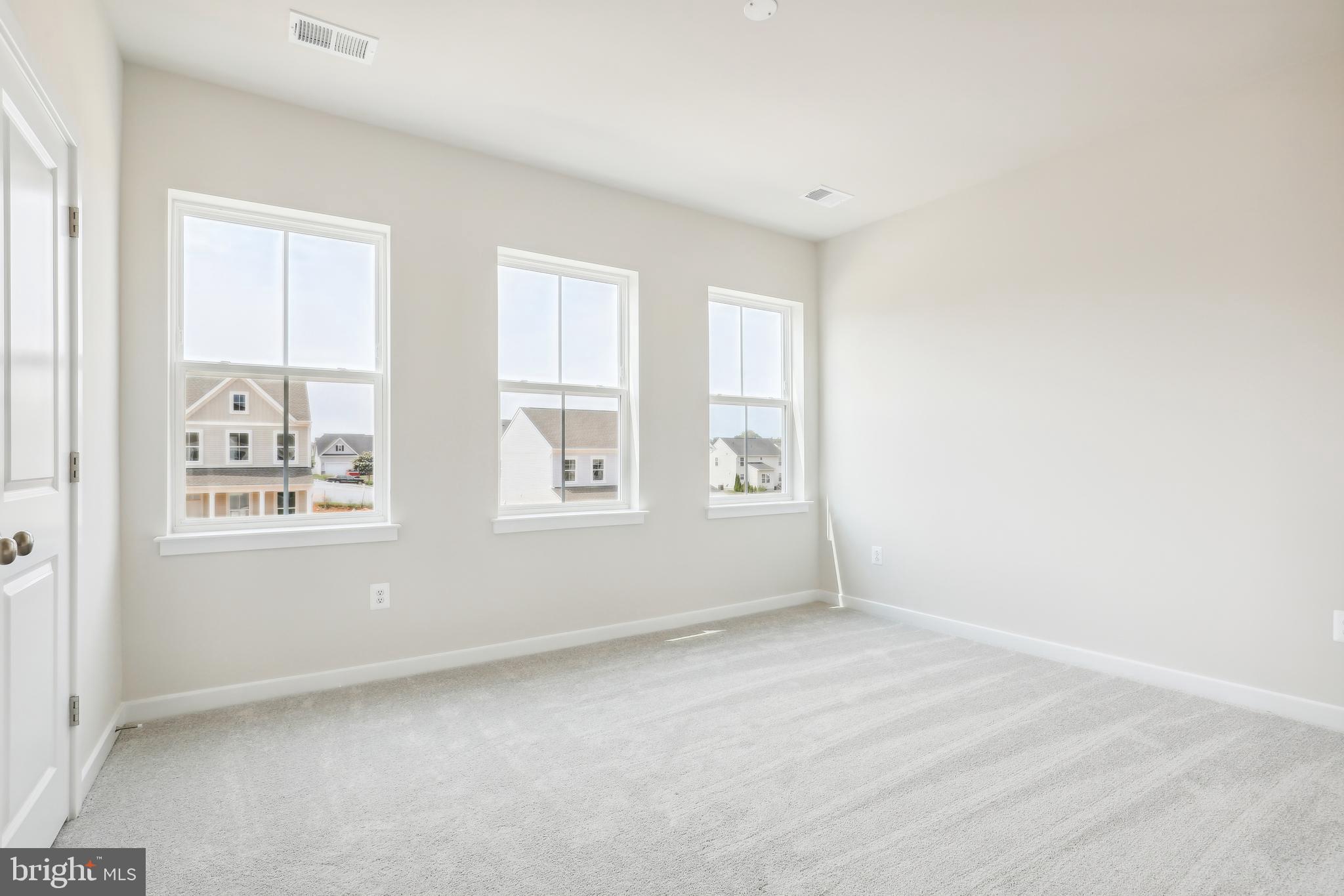 430 Silver Birch Drive, Unit ASHTON 241 Ranson, WV 25438 - Photo 9 of 23 an empty room with windows