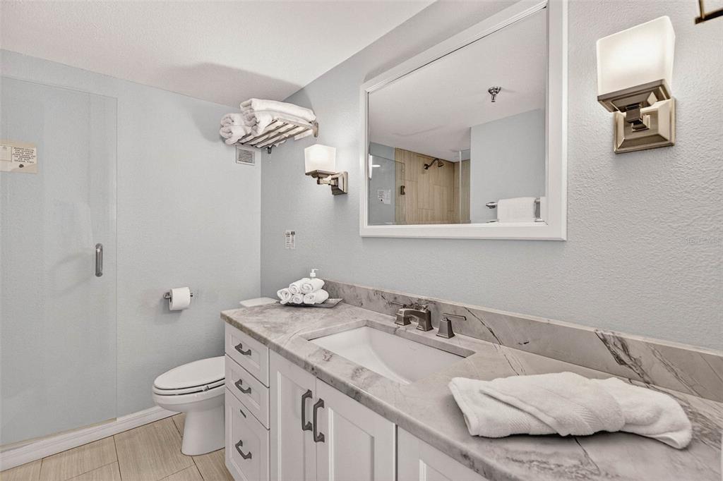 14300 Gulf Boulevard, Unit 104 Madeira Beach, FL 33708 - Photo 24 of 42 a bathroom with a sink and a toilet