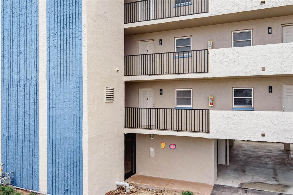 14300 Gulf Boulevard, Unit 104 Madeira Beach, FL 33708 - Photo 42 of 42 a front view of a house with a garage