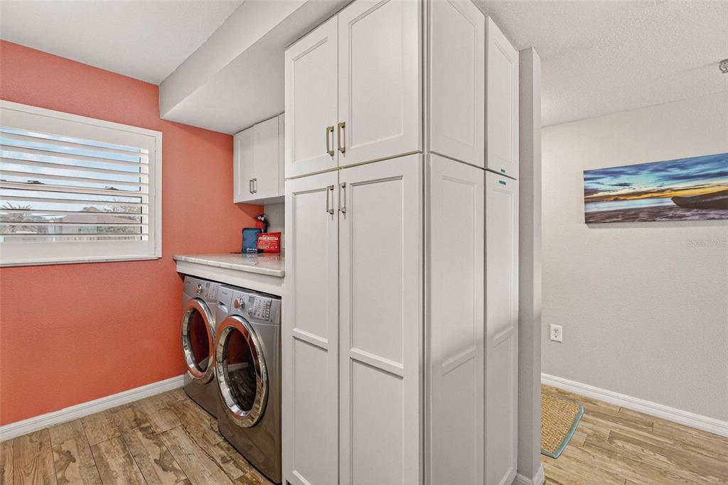 14300 Gulf Boulevard, Unit 104 Madeira Beach, FL 33708 - Photo 10 of 42 a storage room with washer and dryer