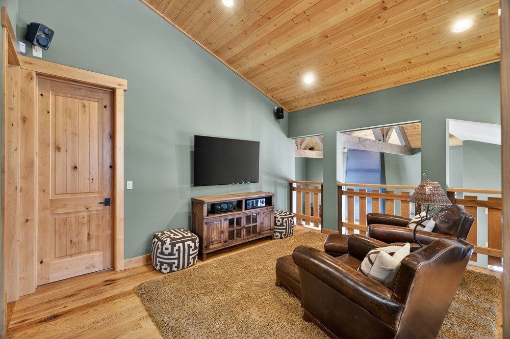 15043 Wolfgang Road Truckee, CA 96161 - Photo 19 of 28 a living room with furniture and a flat screen tv
