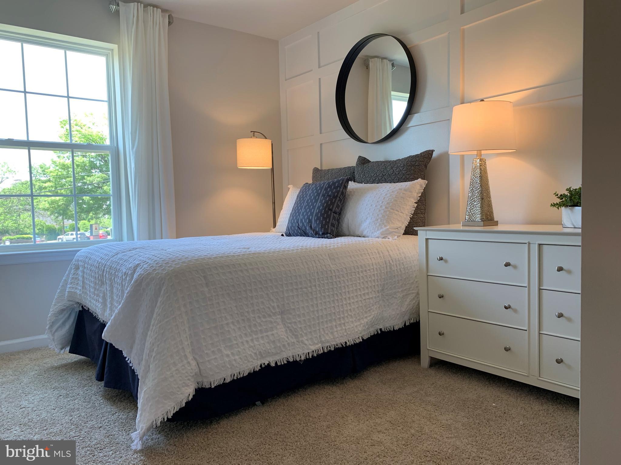 38 Peregrine Way Burlington, NJ 08016 - Photo 20 of 34 a bedroom with a bed mirror and window