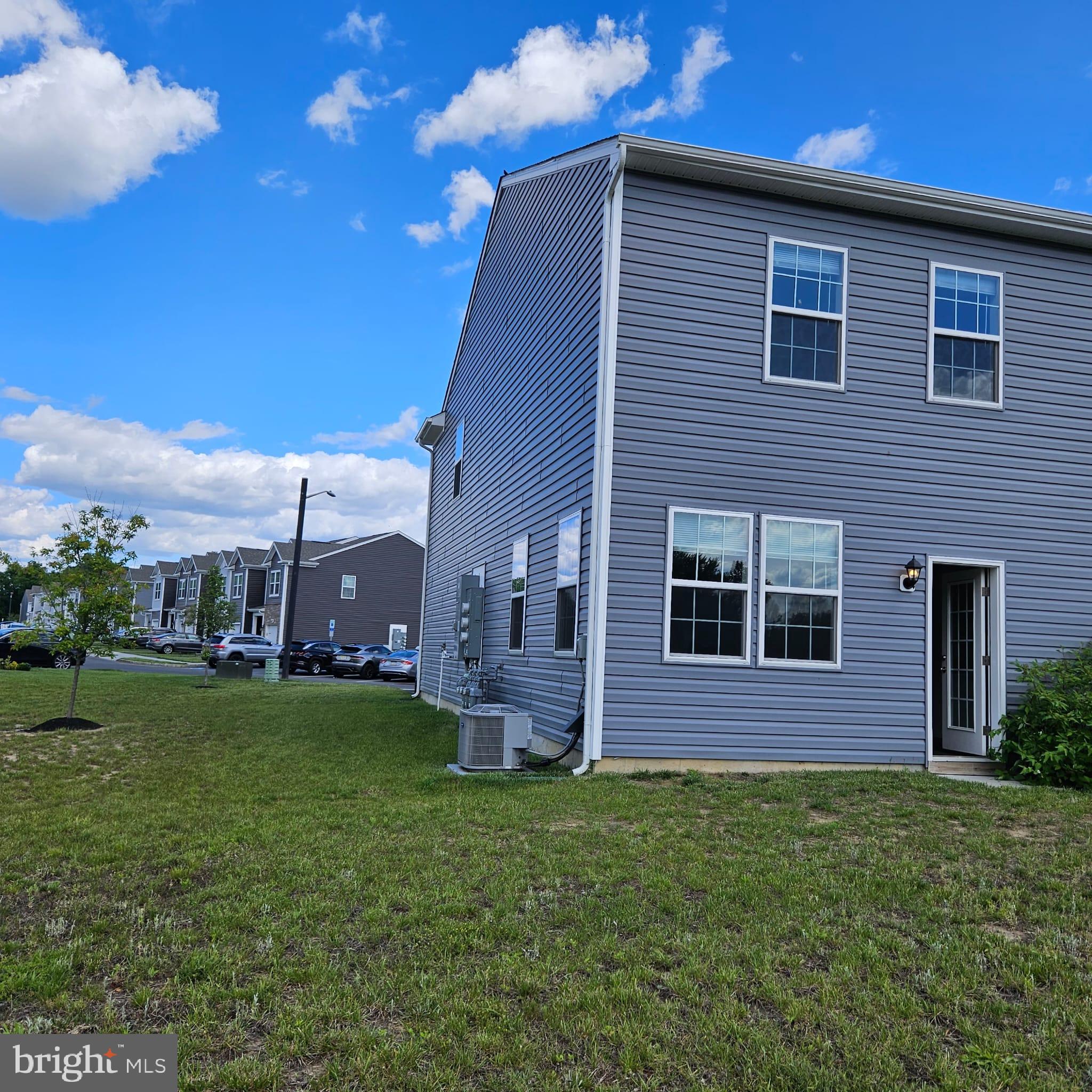 38 Peregrine Way Burlington, NJ 08016 - Photo 24 of 34 a brick building with a yard