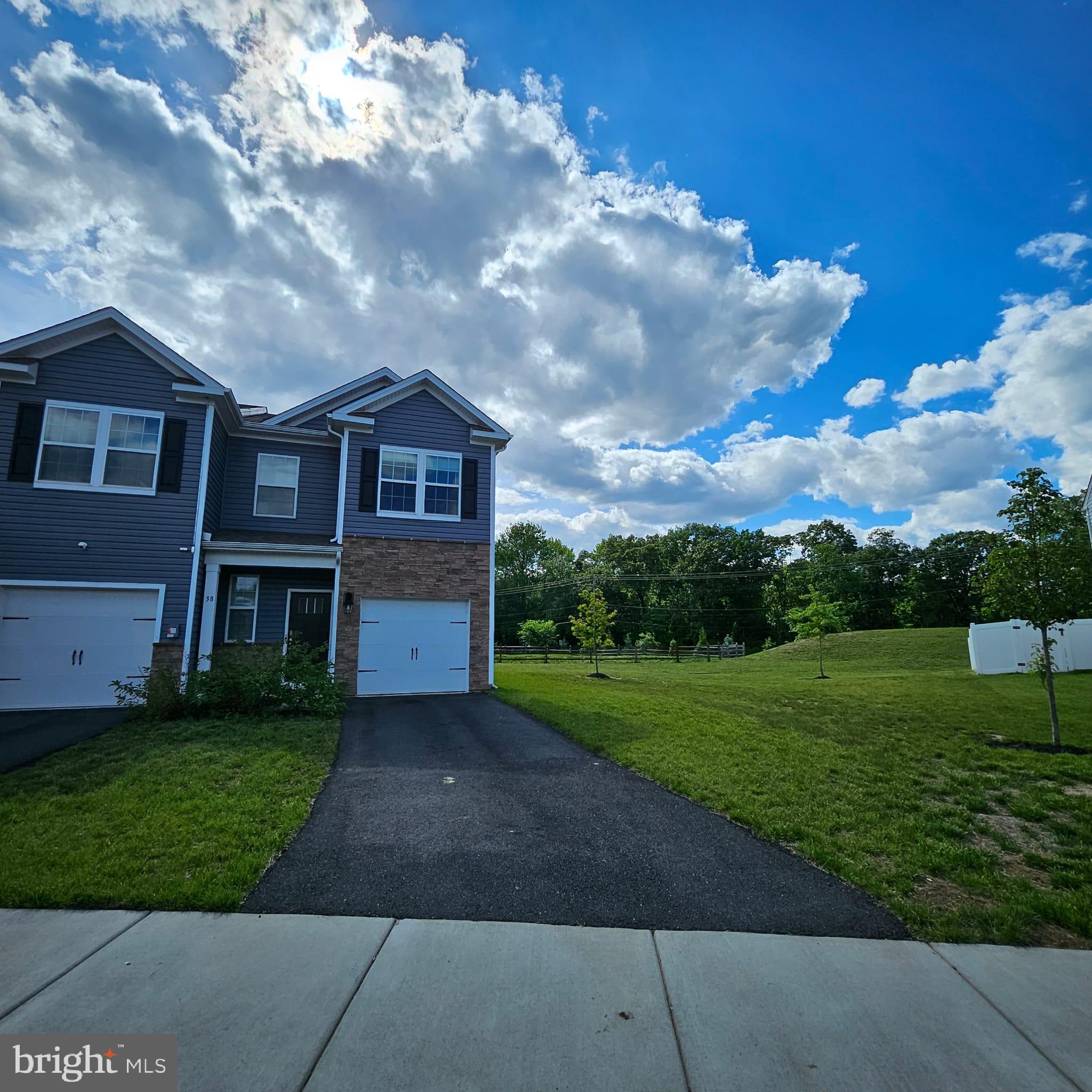 38 Peregrine Way Burlington, NJ 08016 - Photo 3 of 34 a view of a big house with a big yard and large trees