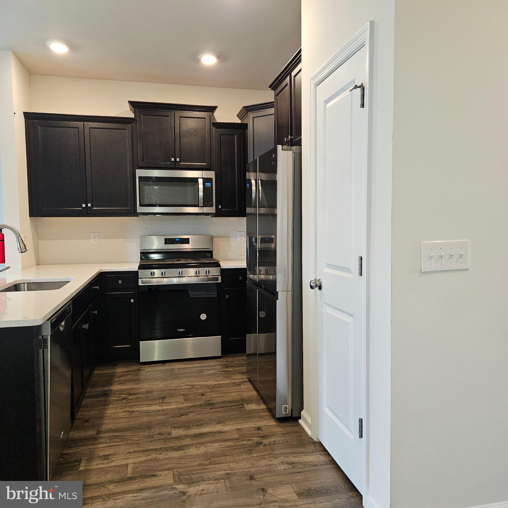38 Peregrine Way Burlington, NJ 08016 - Photo 5 of 34 a kitchen with stainless steel appliances granite countertop a refrigerator and a sink