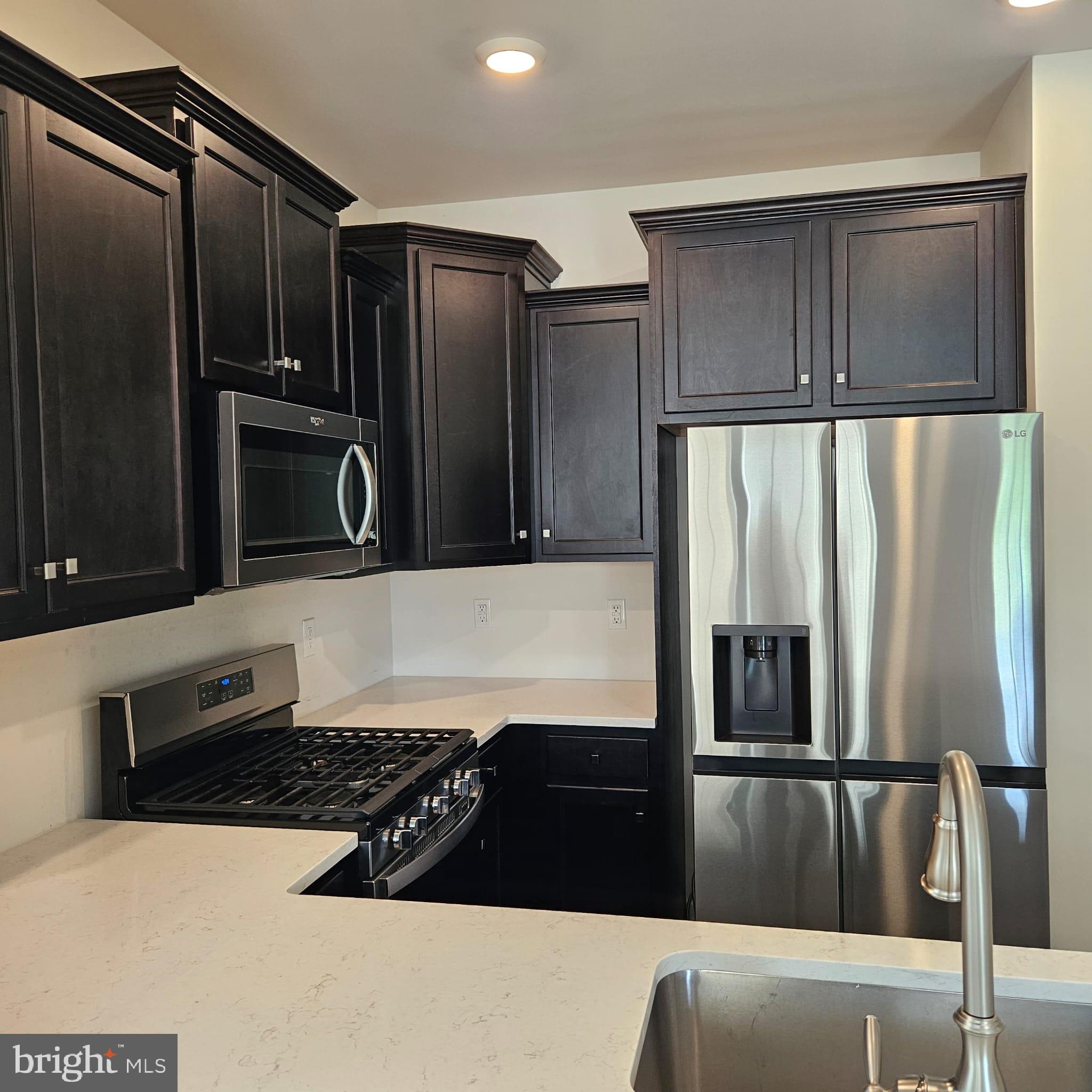 38 Peregrine Way Burlington, NJ 08016 - Photo 6 of 34 a kitchen with stainless steel appliances granite countertop a refrigerator and a stove