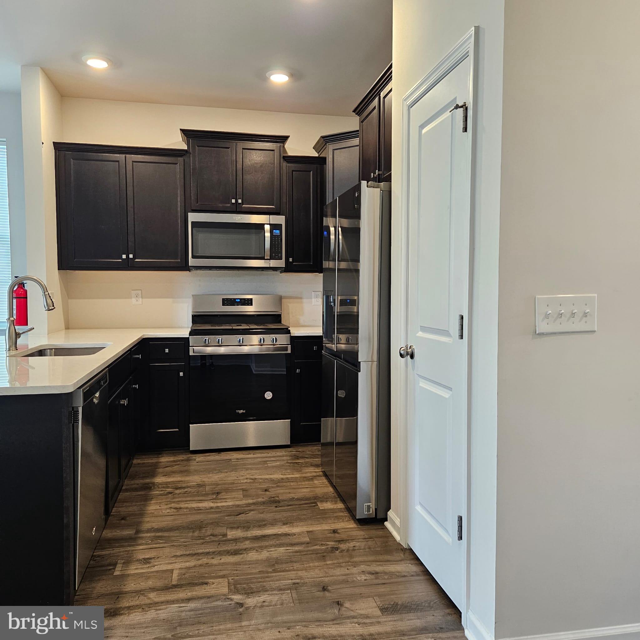 38 Peregrine Way Burlington, NJ 08016 - Photo 8 of 34 a kitchen with stainless steel appliances granite countertop a refrigerator and a sink