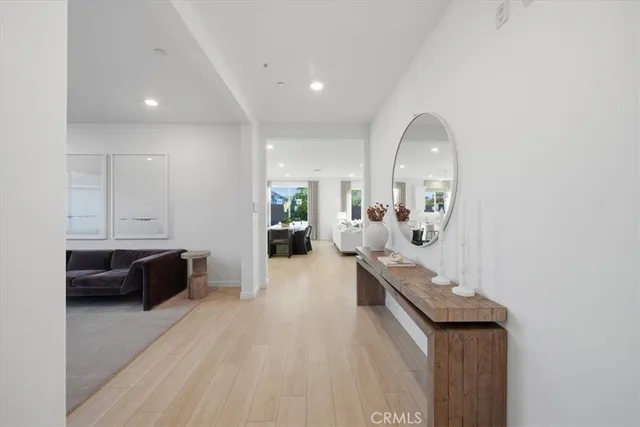 a view of living room with furniture and wooden floor