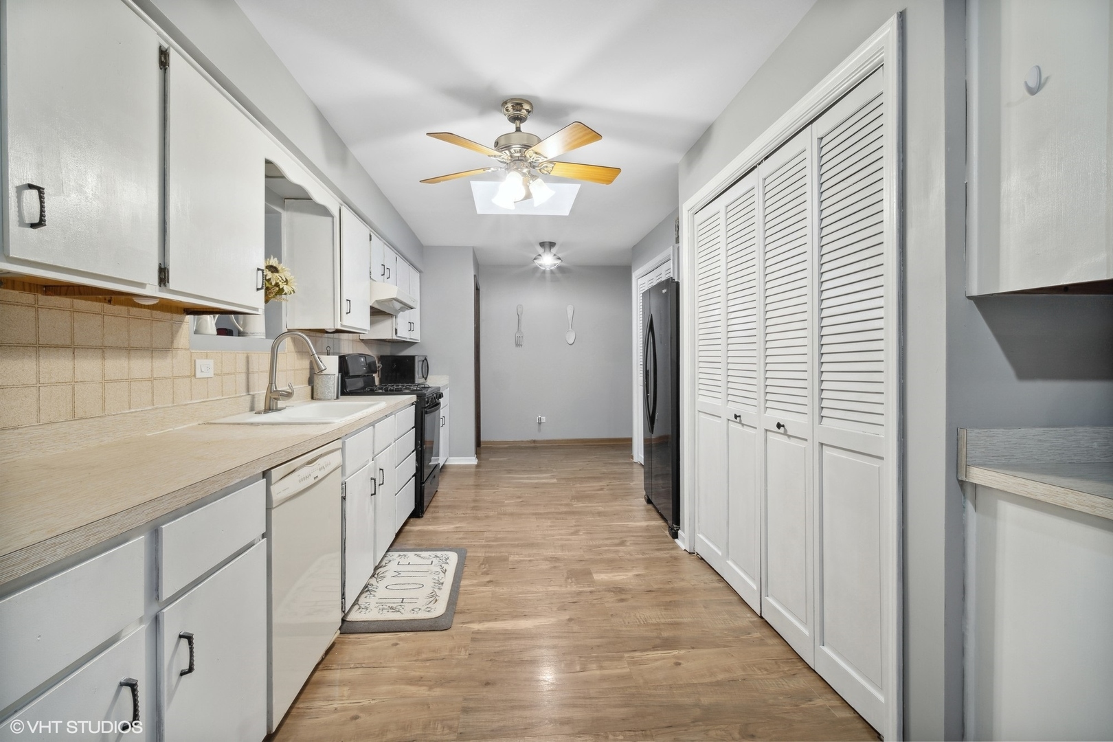 933 North Midlothian Road Mundelein, IL 60060 - Photo 4 of 16 a kitchen with a sink refrigerator and cabinets