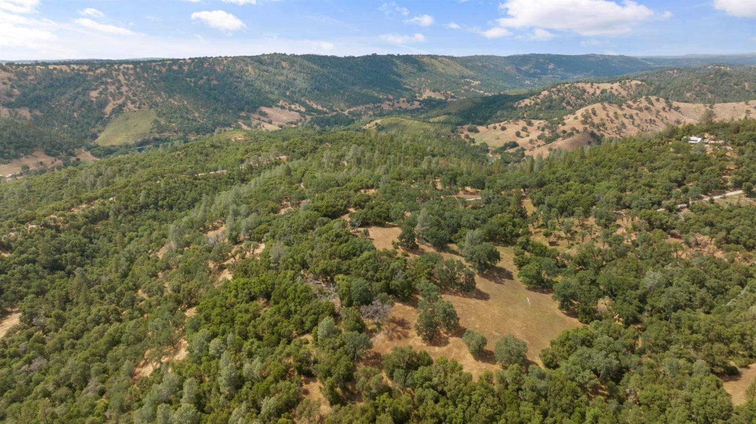 2 Bell Road Plymouth, CA 95669 - Photo 11 of 20 a view of a lake with mountains in the background