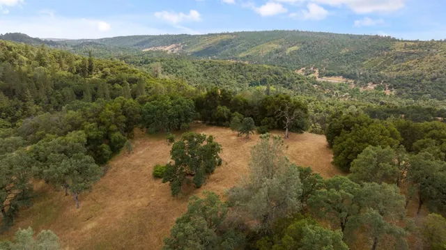 a view of a town with mountains in the background