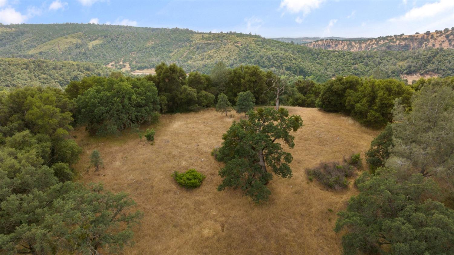 2 Bell Road Plymouth, CA 95669 - Photo 9 of 20 a view of a lake with mountains in the background