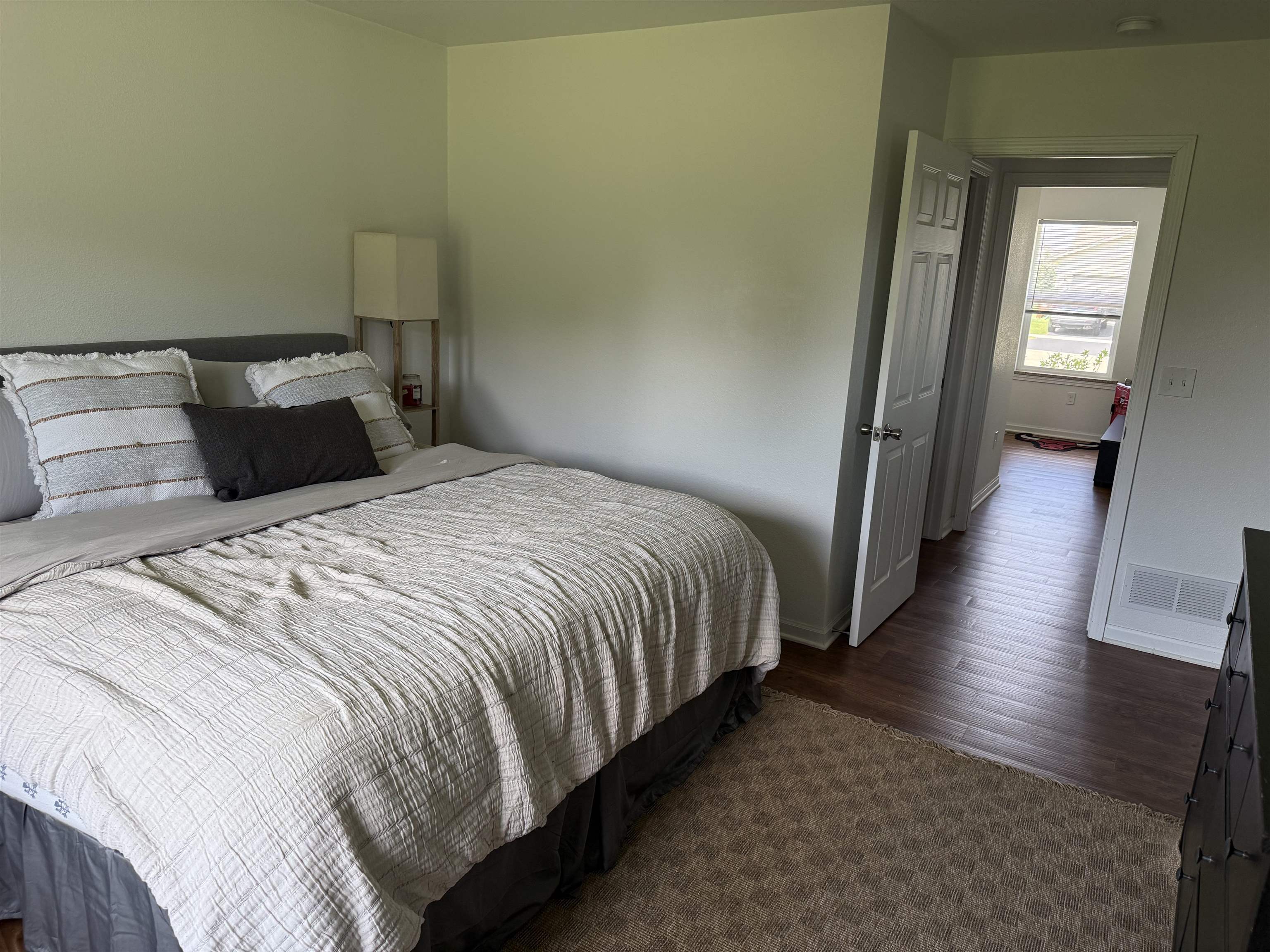 1135 Russell Road Belvidere, IL 61008 - Photo 9 of 11 a bedroom with double bed and a wooden floor