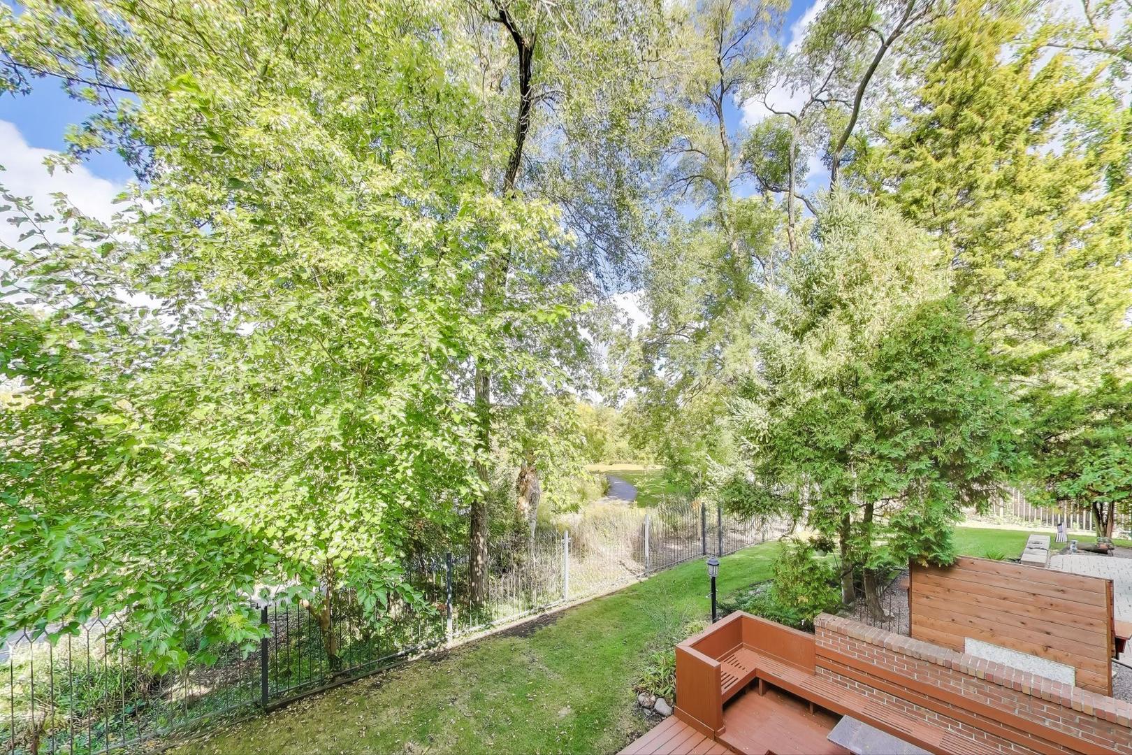 300 Boardwalk Place Park Ridge, IL 60068 - Photo 17 of 52 a view of a bench in a garden