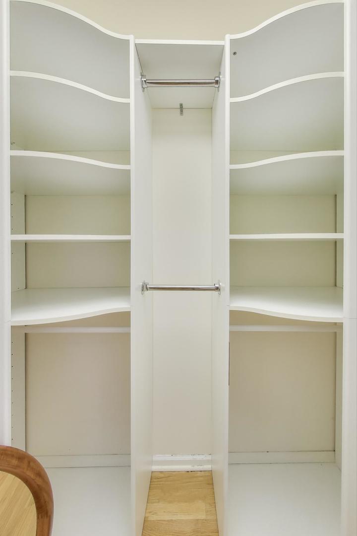 300 Boardwalk Place Park Ridge, IL 60068 - Photo 26 of 52 a view of walk in closet with empty racks