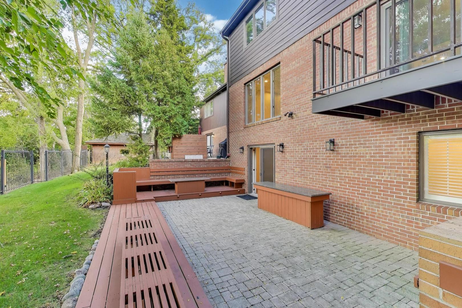 300 Boardwalk Place Park Ridge, IL 60068 - Photo 45 of 52 a view of a patio with a table and chairs