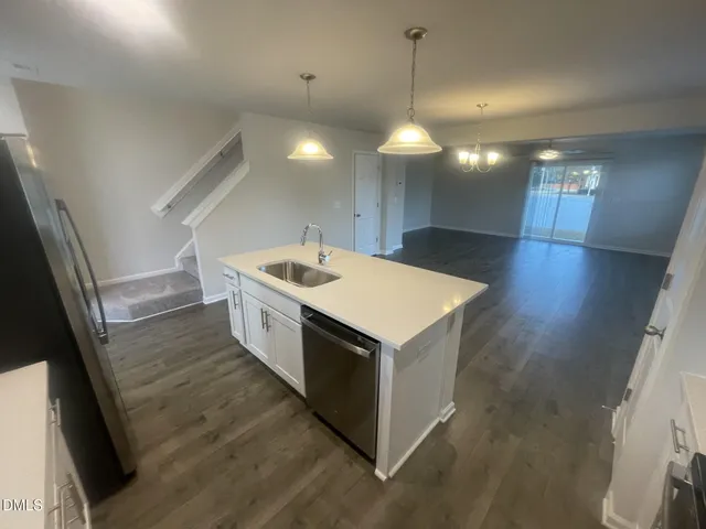 a kitchen with a stove and a sink