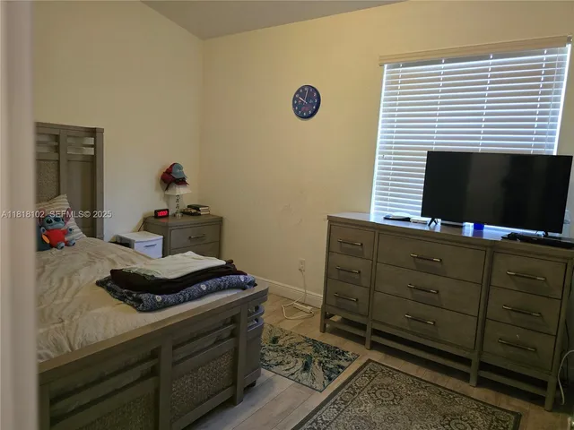 a room with storage and flat screen tv