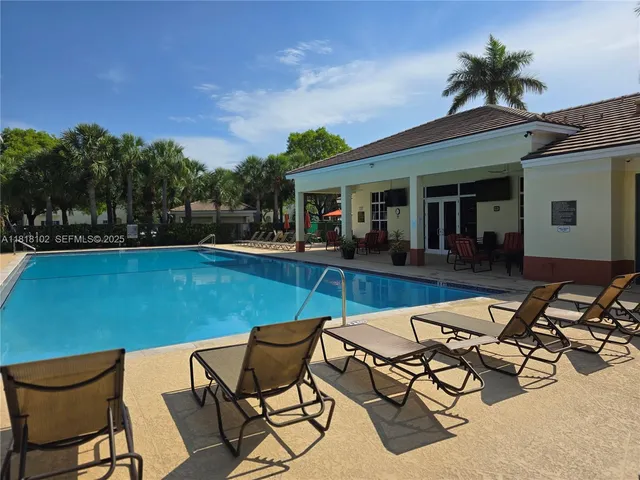 a view of a chairs and table in patio