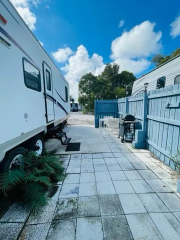 a view of a backyard with sitting area