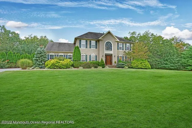 a view of a garden in front of the house