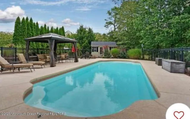 a view of a swimming pool with a patio