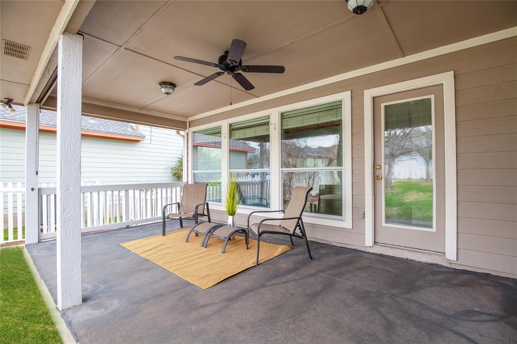 281 Hutton Kyle, TX 78640 - Photo 34 of 37 An inviting covered patio offers a comfortable outdoor living space for relaxation.