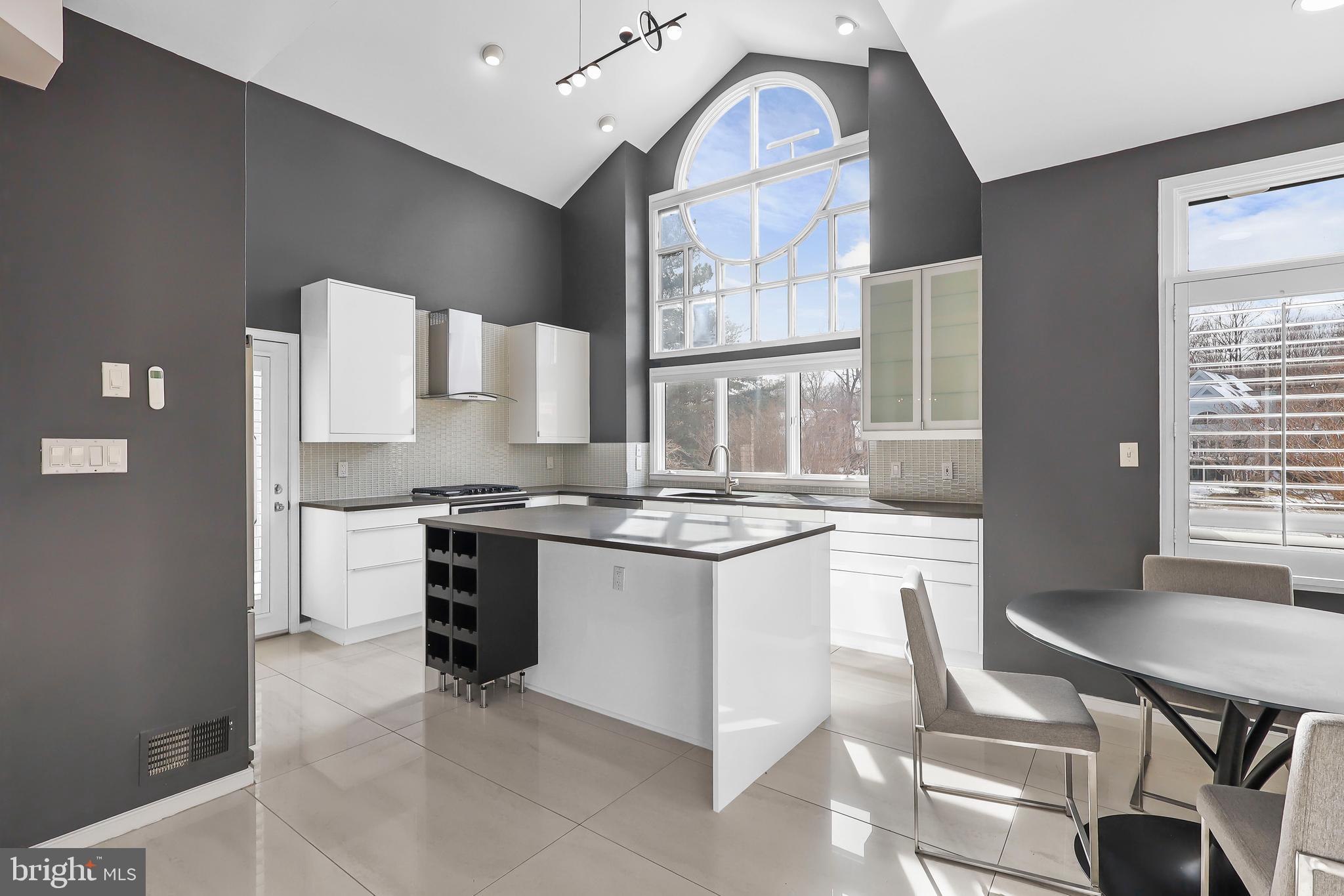 1460 Waterfront Road Reston, VA 20194 - Photo 14 of 63 a kitchen with stainless steel appliances granite countertop a stove a sink and a refrigerator