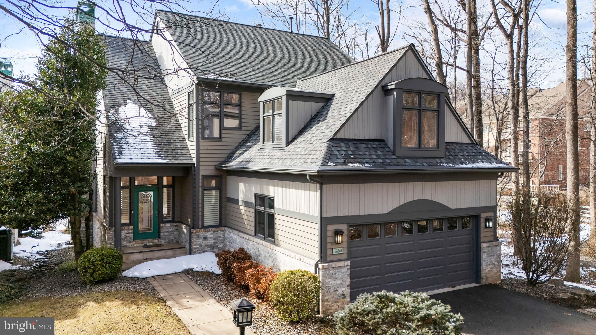 1460 Waterfront Road Reston, VA 20194 - Photo 2 of 63 a front view of a house with a yard