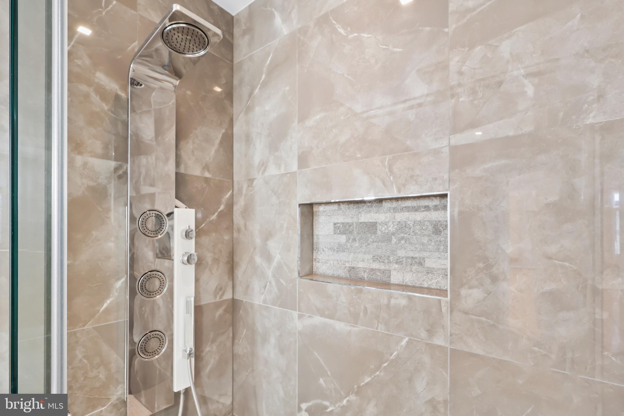 1460 Waterfront Road Reston, VA 20194 - Photo 24 of 63 a bathroom with a glass shower door