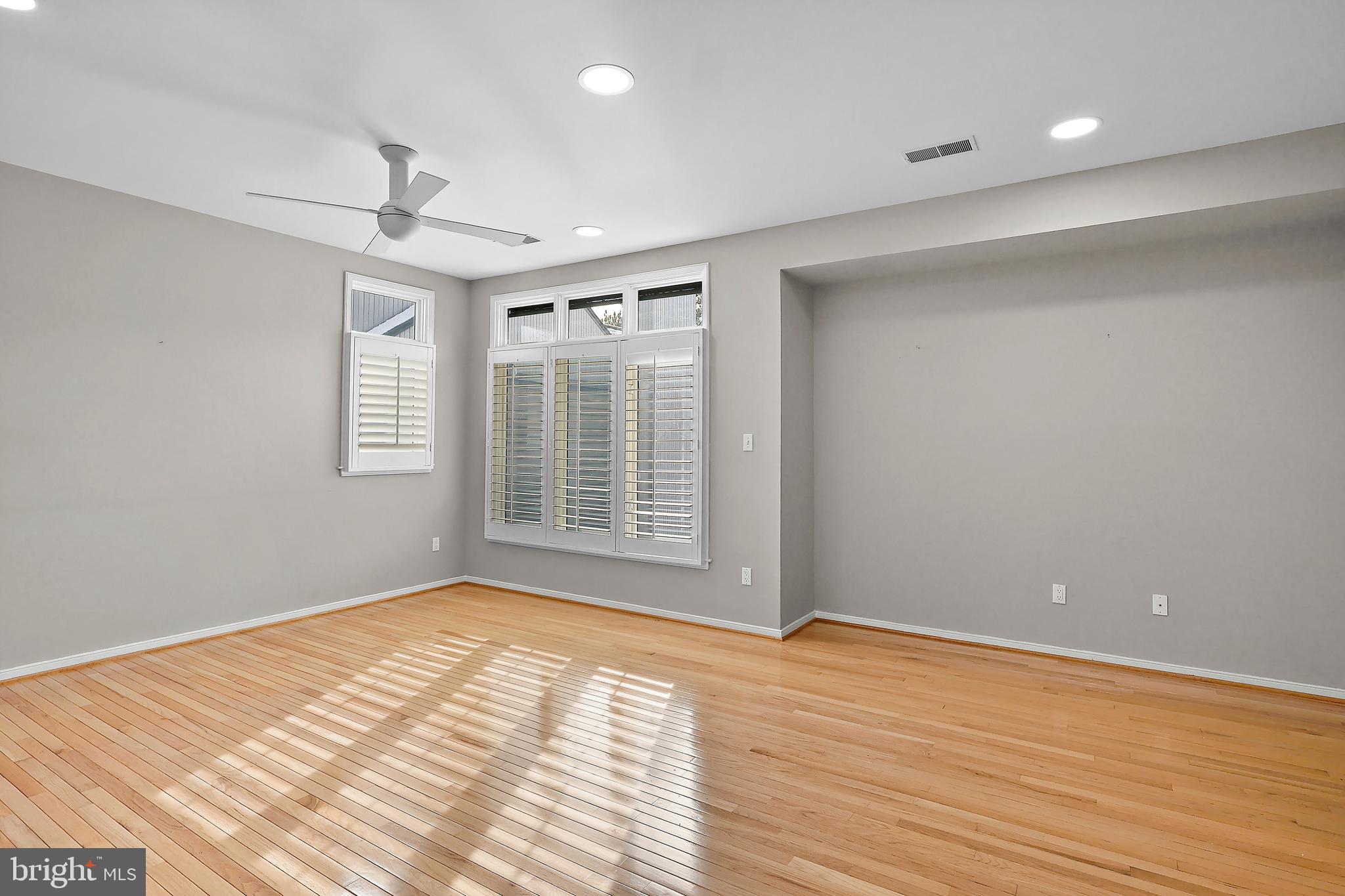 1460 Waterfront Road Reston, VA 20194 - Photo 26 of 63 a view of an empty room with wooden floor and a window