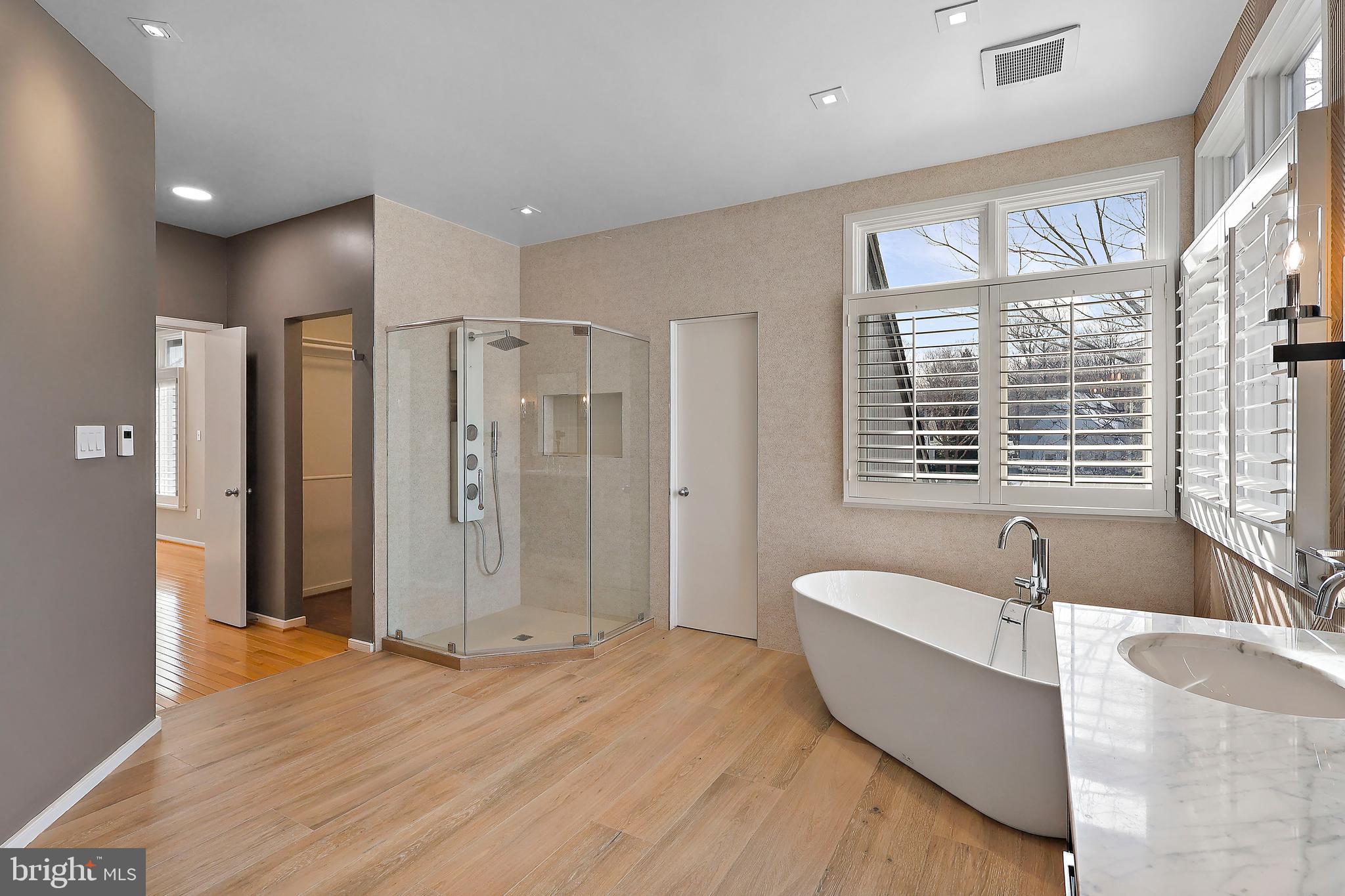 1460 Waterfront Road Reston, VA 20194 - Photo 31 of 63 a spacious bathroom with a granite countertop tub shower and sink