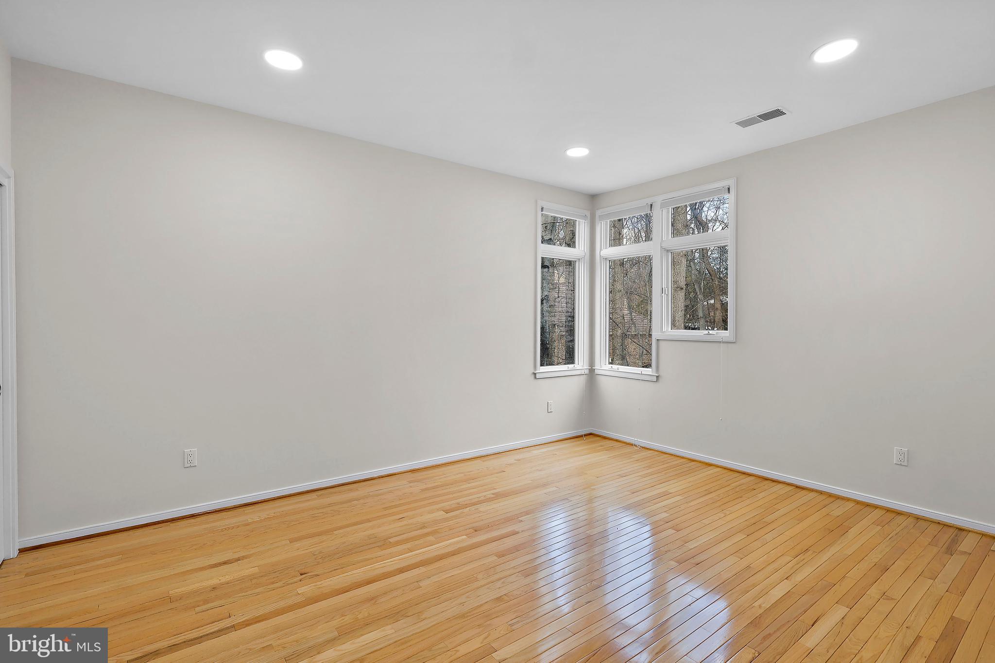 1460 Waterfront Road Reston, VA 20194 - Photo 40 of 63 a view of empty room with wooden floor and fan
