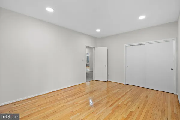 a room with pool table and windows