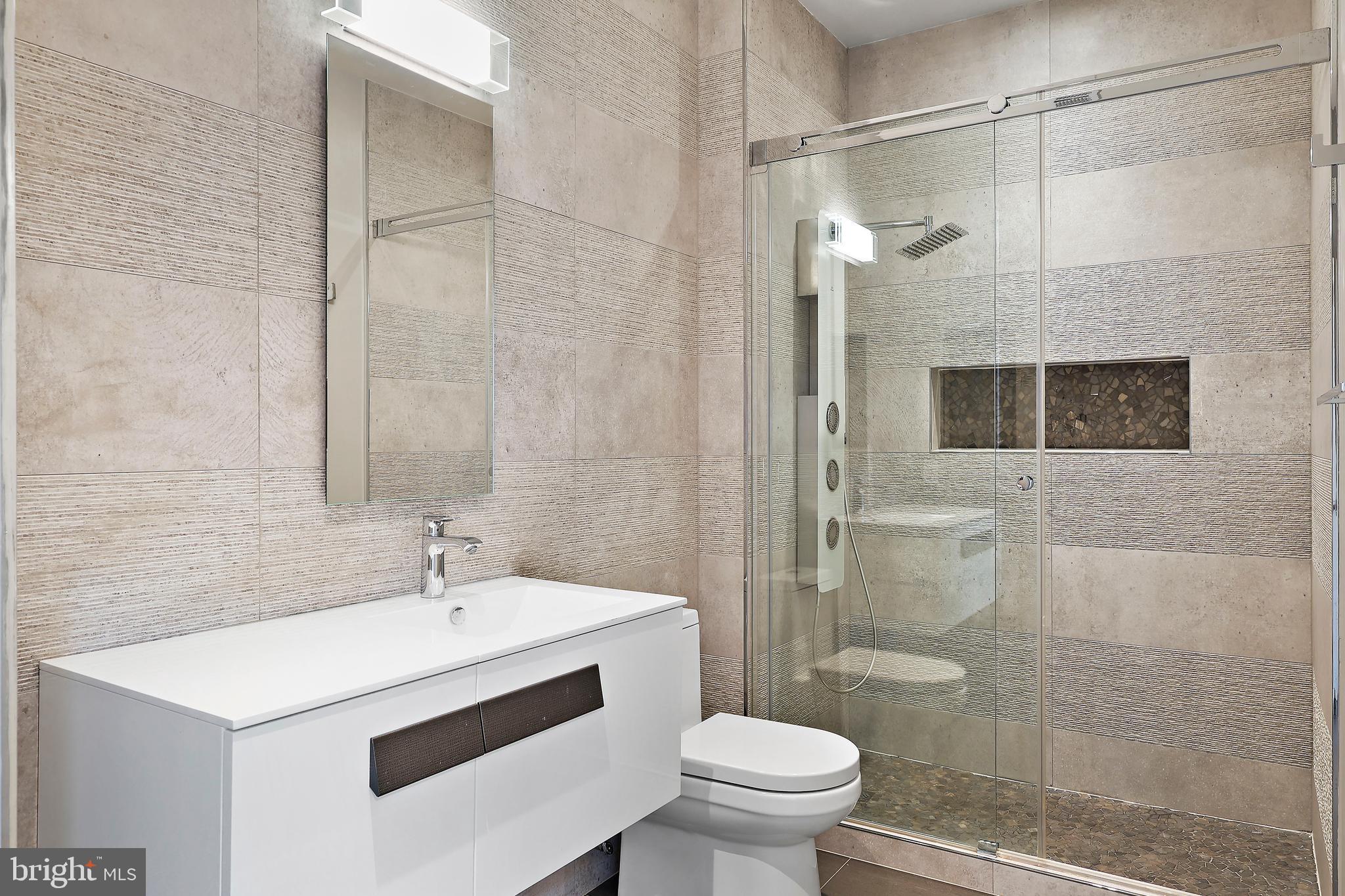 1460 Waterfront Road Reston, VA 20194 - Photo 43 of 63 a bathroom with a sink toilet and shower