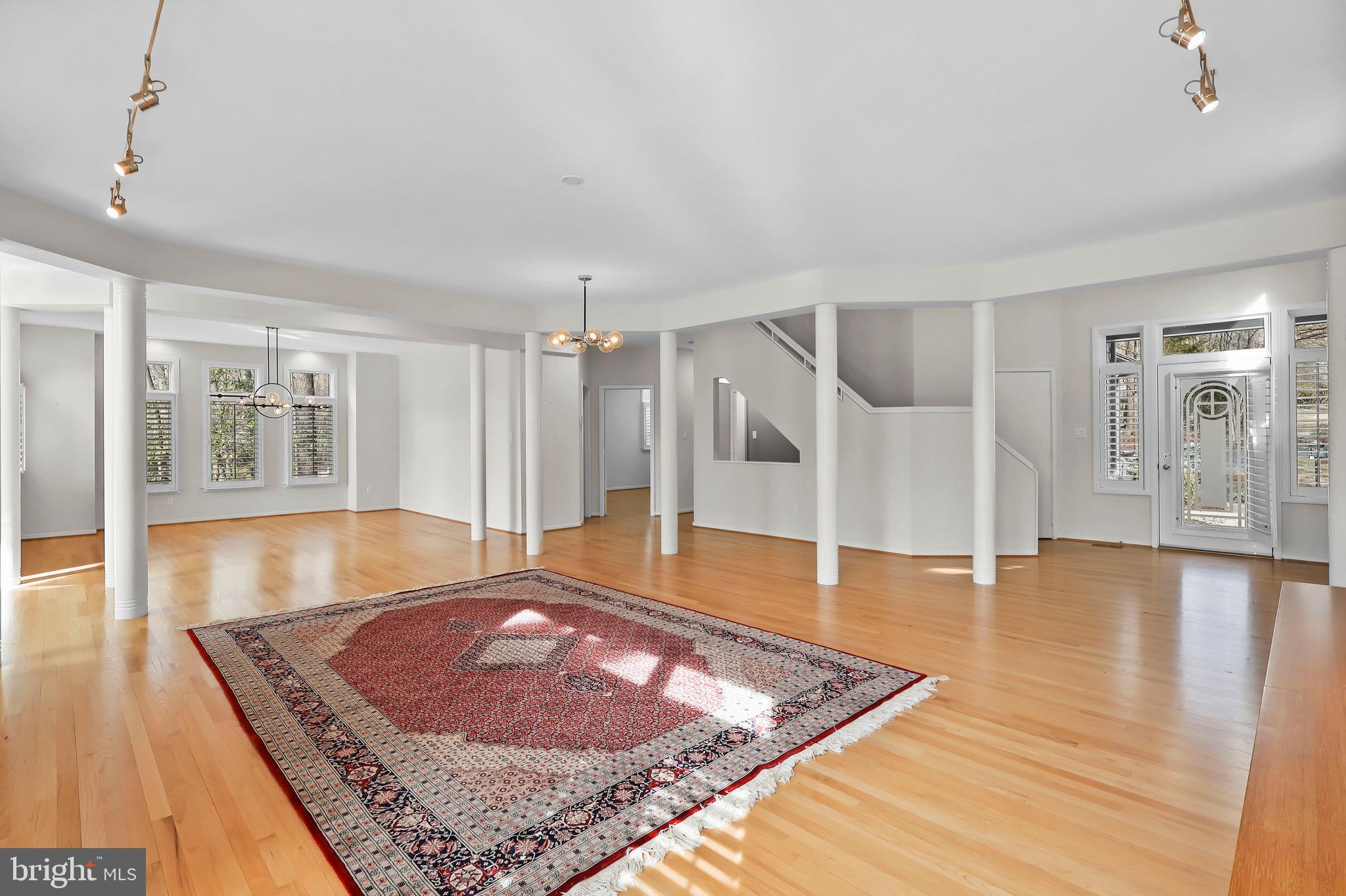 1460 Waterfront Road Reston, VA 20194 - Photo 6 of 63 a view of an empty room with window and wooden floor