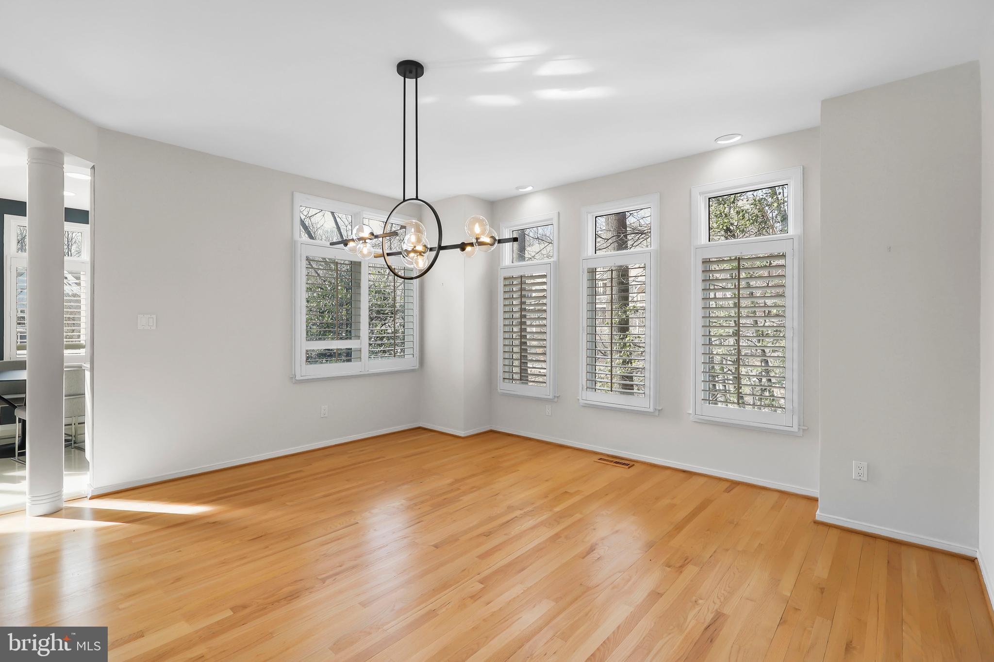 1460 Waterfront Road Reston, VA 20194 - Photo 10 of 63 a view of an empty room with window and wooden floor
