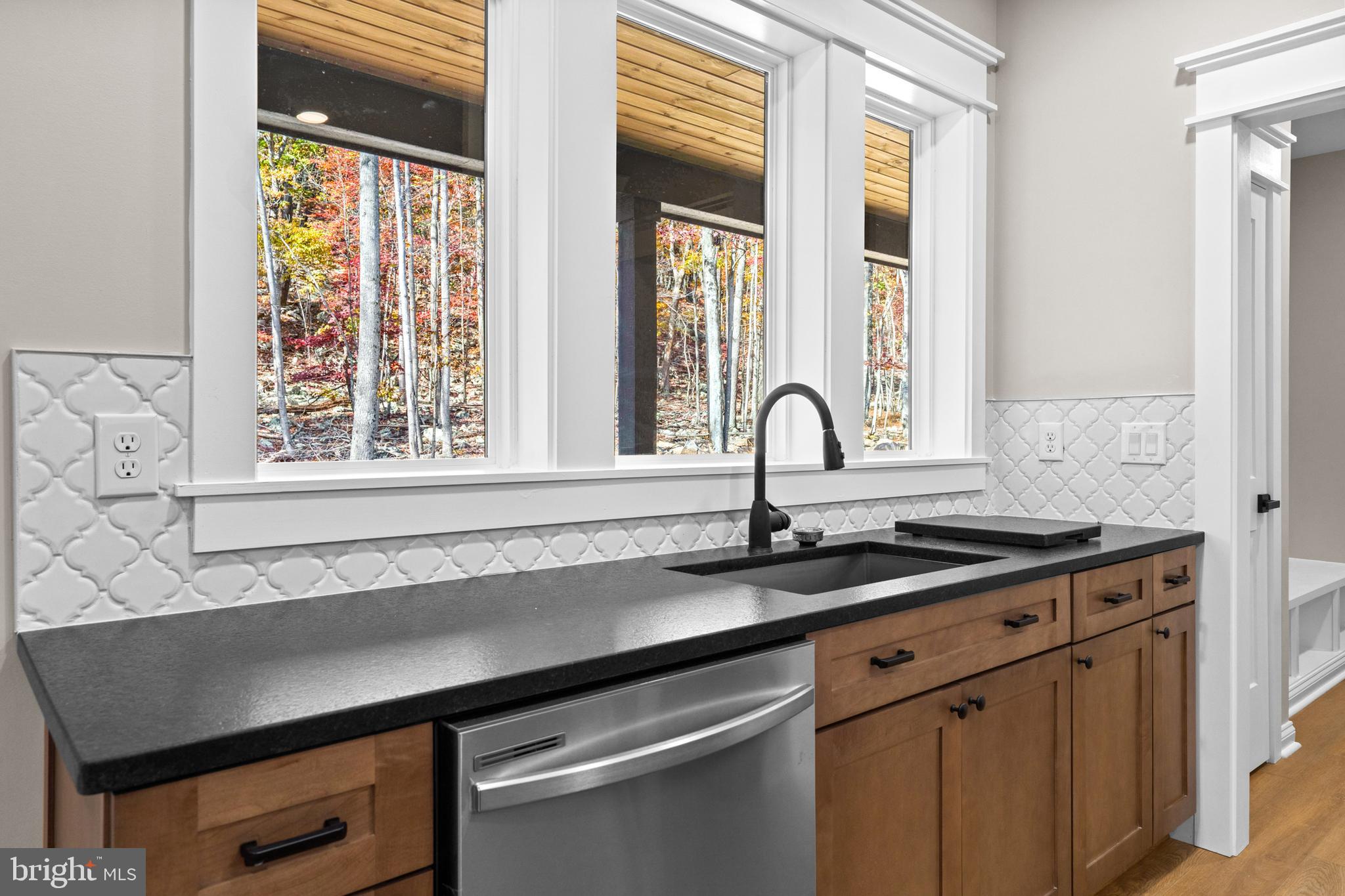 89 Parkside Terrace Berkeley Springs, WV 25411 - Photo 13 of 32 a kitchen with a sink and a window