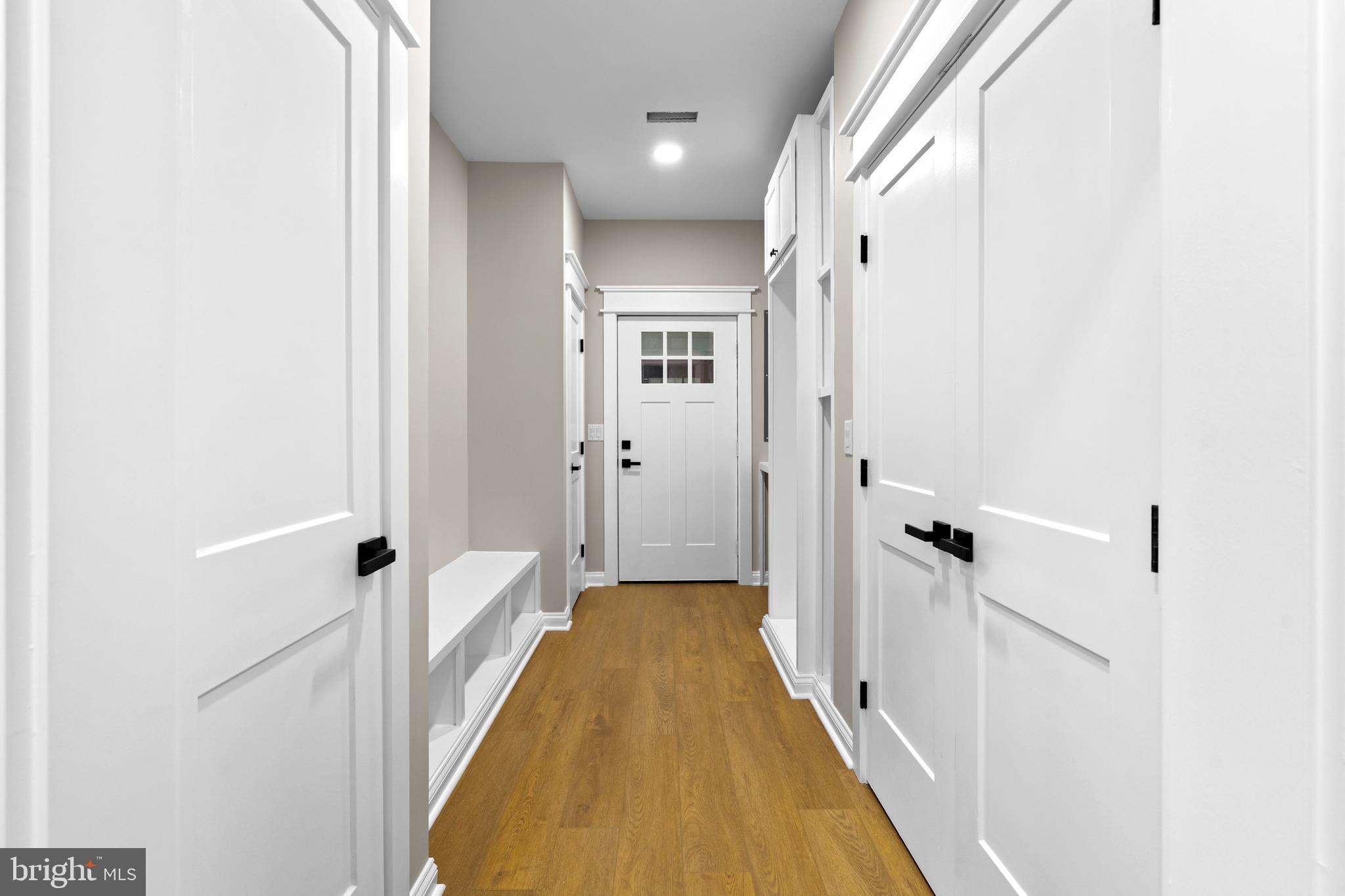 89 Parkside Terrace Berkeley Springs, WV 25411 - Photo 17 of 32 a view of a hallway with wooden floor and staircase