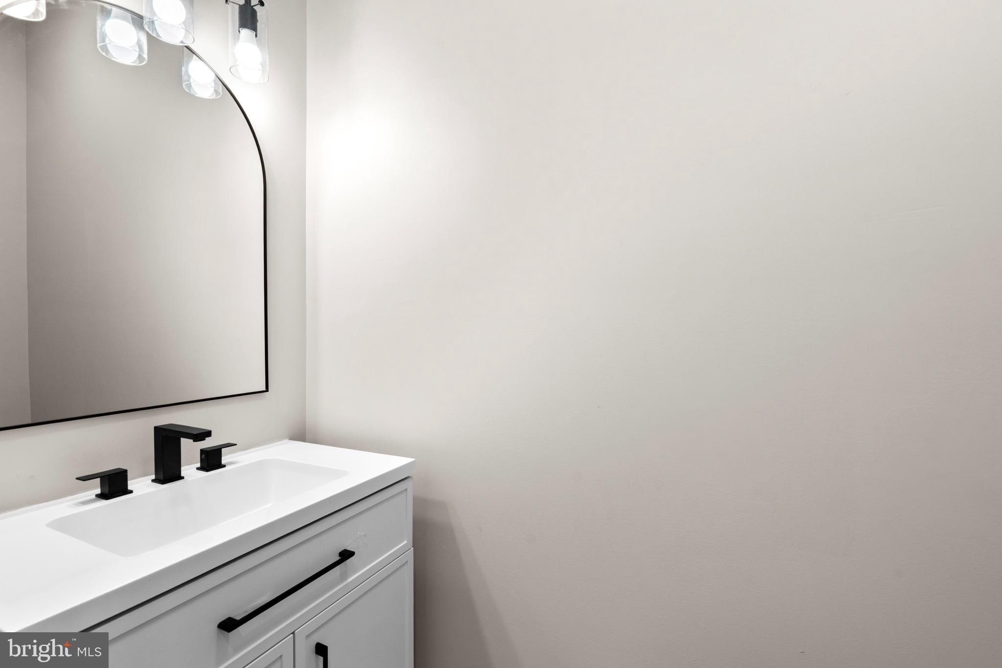 89 Parkside Terrace Berkeley Springs, WV 25411 - Photo 19 of 32 a bathroom with a sink and a mirror