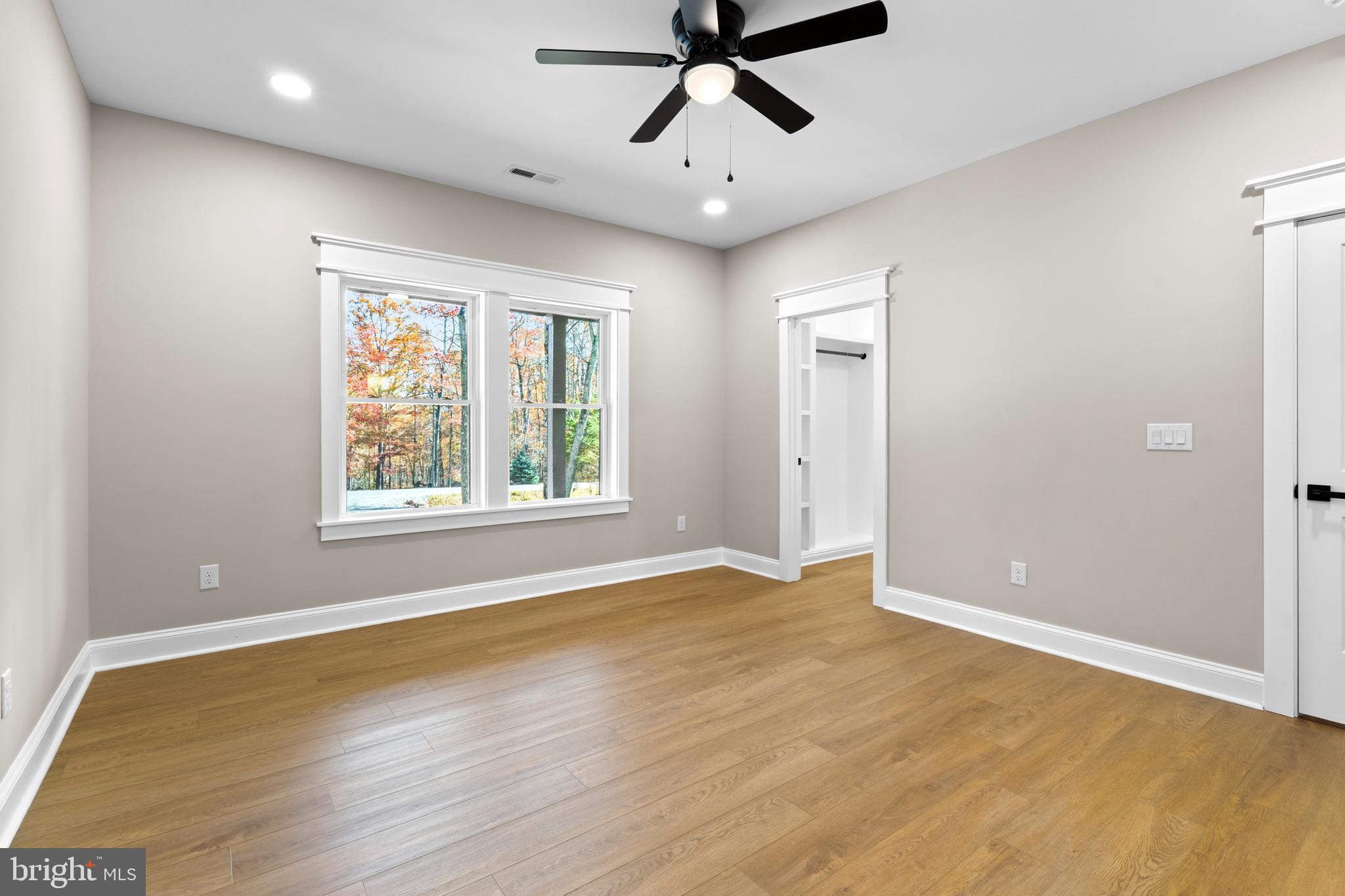 89 Parkside Terrace Berkeley Springs, WV 25411 - Photo 20 of 32 wooden floor in an empty room with a window