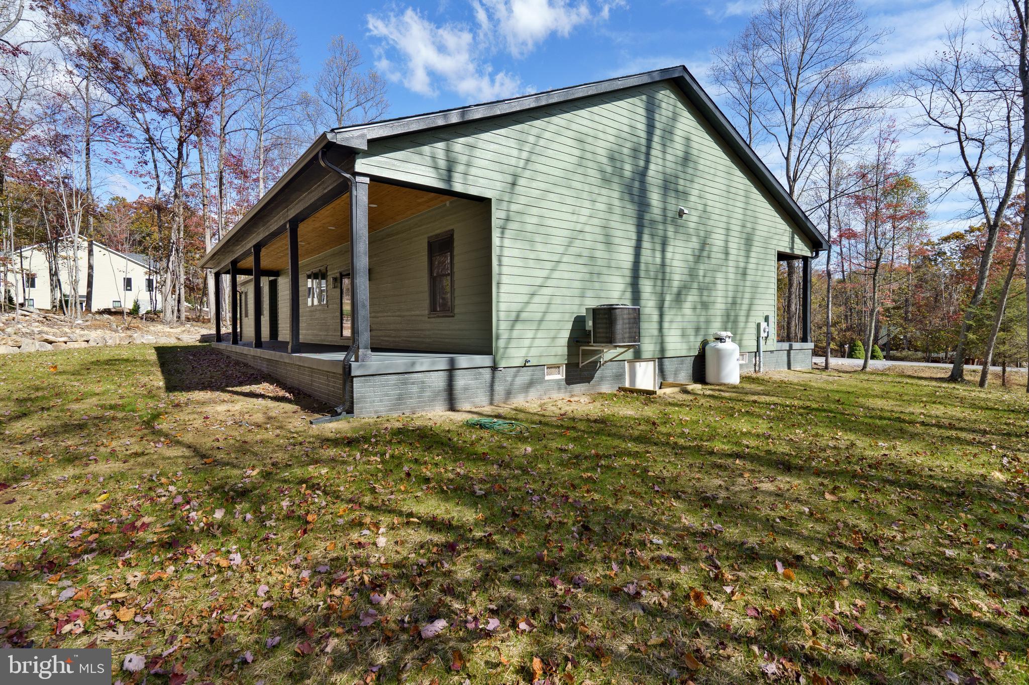 89 Parkside Terrace Berkeley Springs, WV 25411 - Photo 28 of 32 a backyard of a house with table and chairs